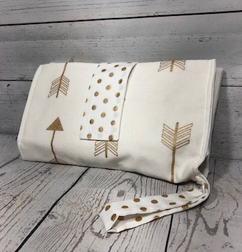 white with gold arrow nappy wallet